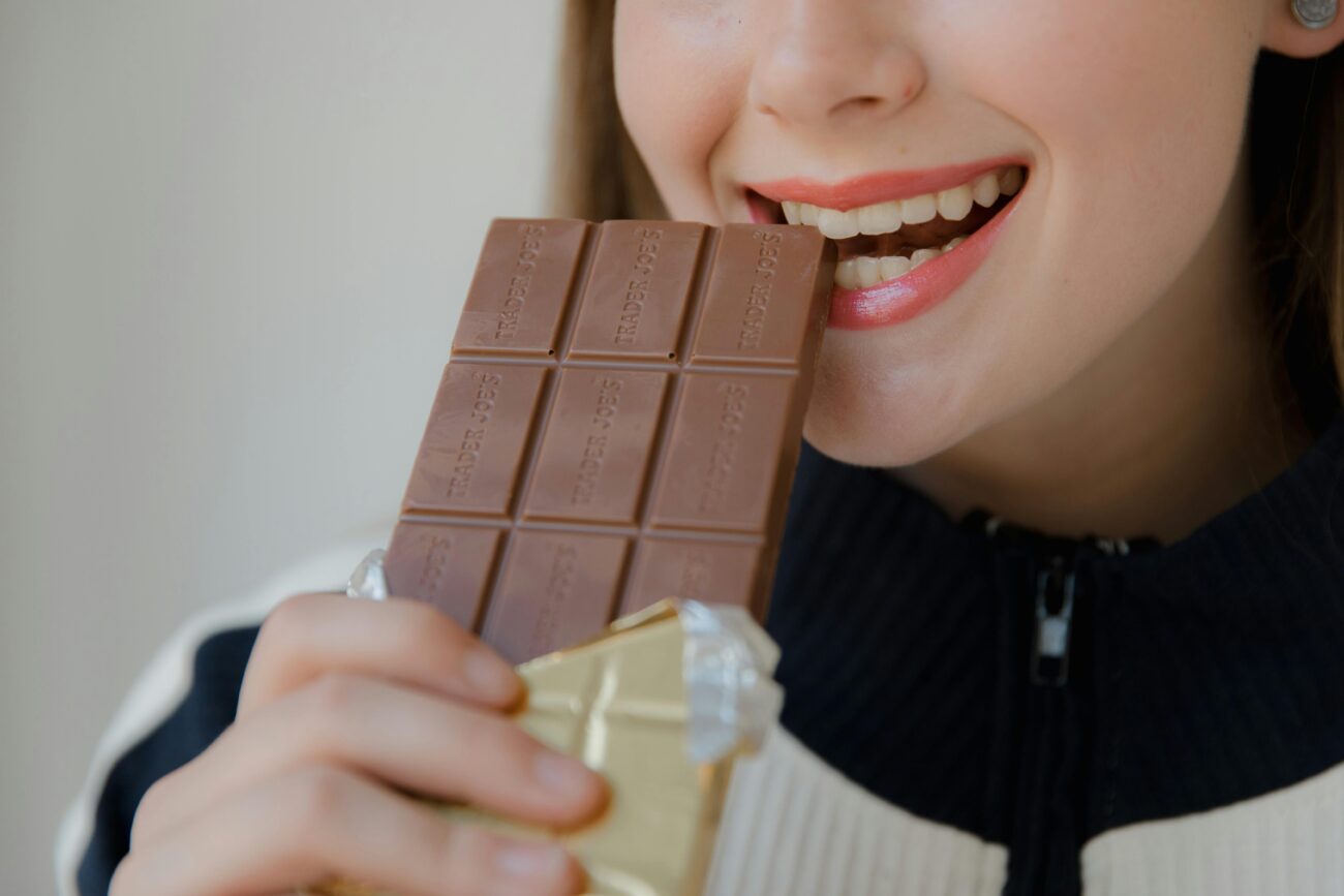 a girl eating Chocolate After Nissen Fundoplication