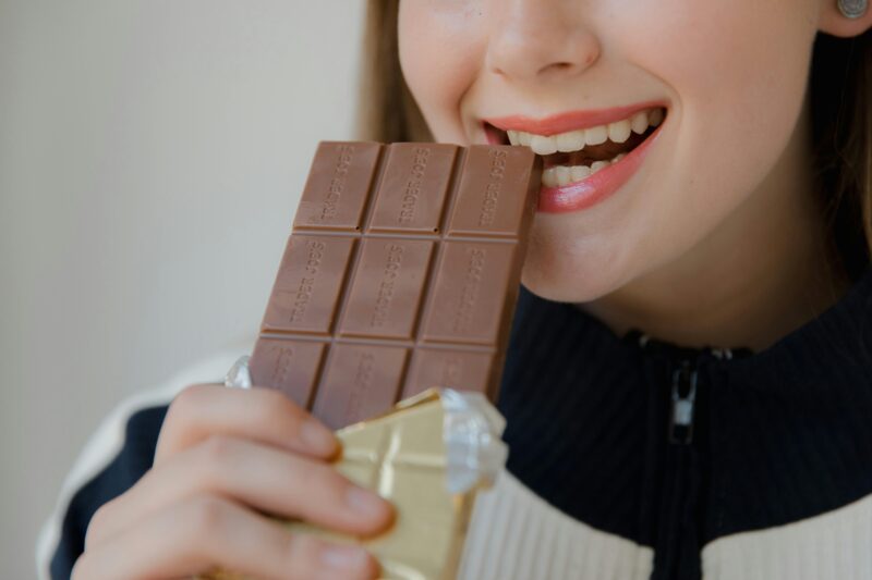 a girl eating Chocolate After Nissen Fundoplication