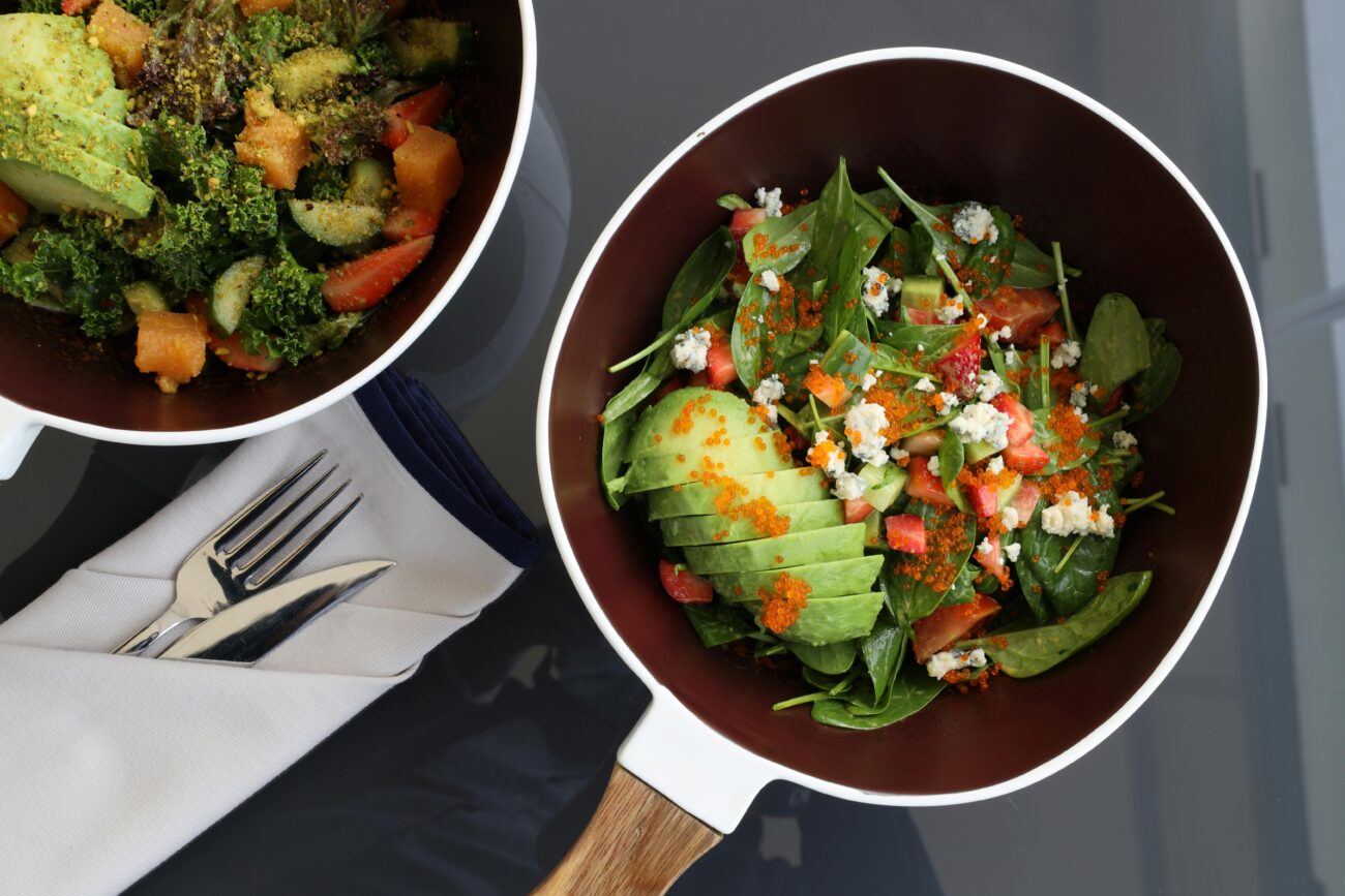 a frying pan with Avocado Omelette with Tomatoes and Spinach